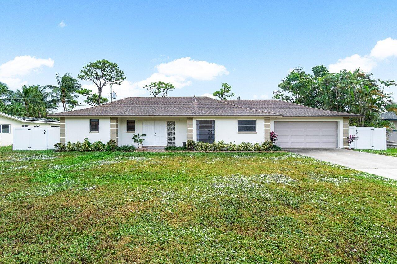Your perfect Florida oasis is now available on an oversized lot in beautiful Lanier Park! No HOA with a 2.5 car garage. This property offers a split floor plan and meticulous design that's conducive for entertaining and family living. A large kitchen, spacious back patio and fenced in yard are just some of the things that makes this home standout. Located close to I-95, West Palm and Delray Beach. You will never run out of things to do in this beach town. See you soon!