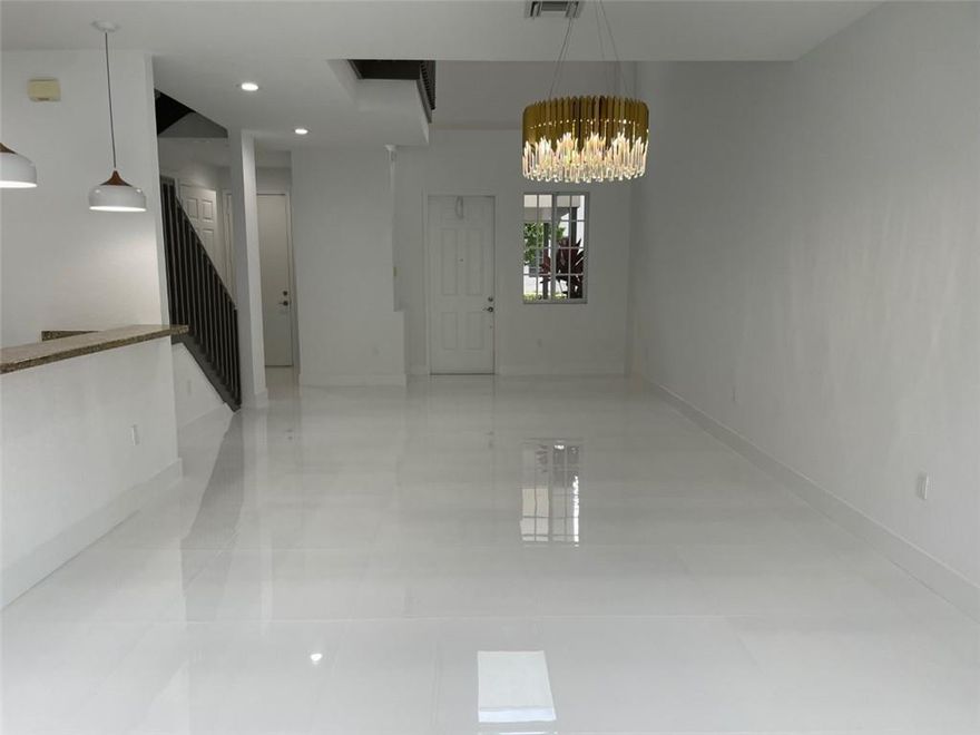 Brand new remodel, new from top to bottom, 1883 sq. ft. of move-in ready beauty!  Stunning white 24 x 24 porcelain tile throughout the first floor, Modern plank vinyl flooring upstairs.  Samsung SS appliances, front loading washer and dryer.  1 car attached garage, 1 car attached carport.  Small but private backyard.  Community features 24/7 security, including gated entrance.  Large community pool.  Low monthly HOA $200.