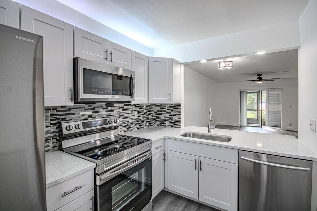 Photo of 7094 Golf Colony Court #102, Lake Worth, FL 33467 (MLS # R11153458)