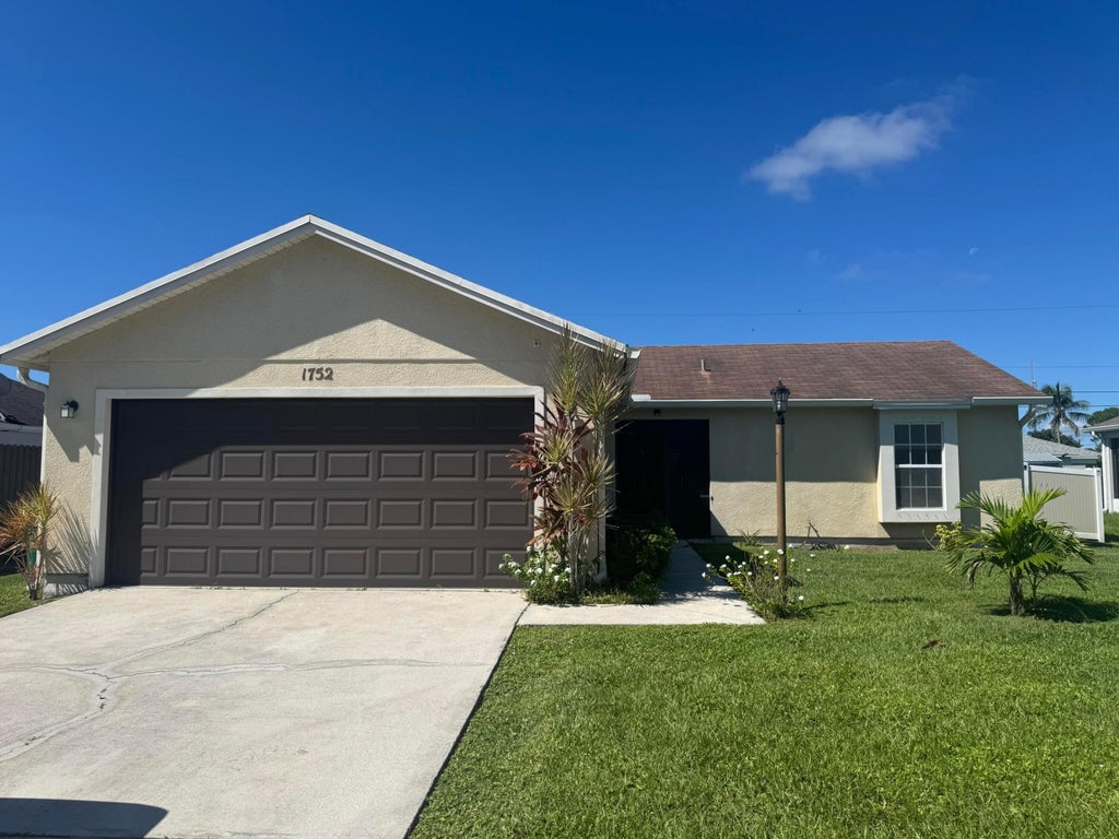 Photo of 1752 SW Bonanza Street, Port Saint Lucie, FL 34953 (MLS # R11131875)