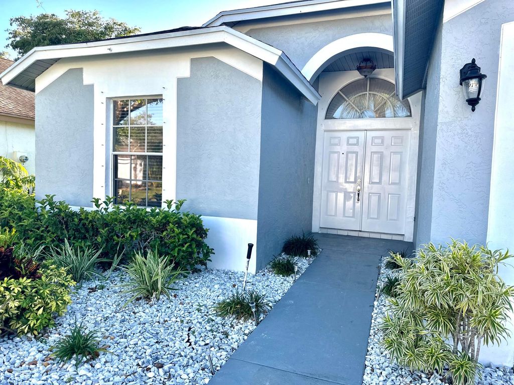 Photo of 420 Trotters Lane, Greenacres, FL 33413 (MLS # R11081161)