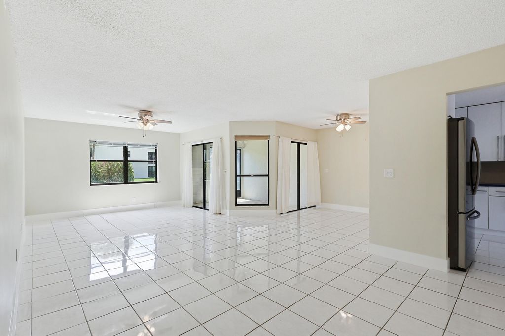 Photo of 3242 Perimeter Drive, Greenacres, FL 33467 (MLS # B26033066)