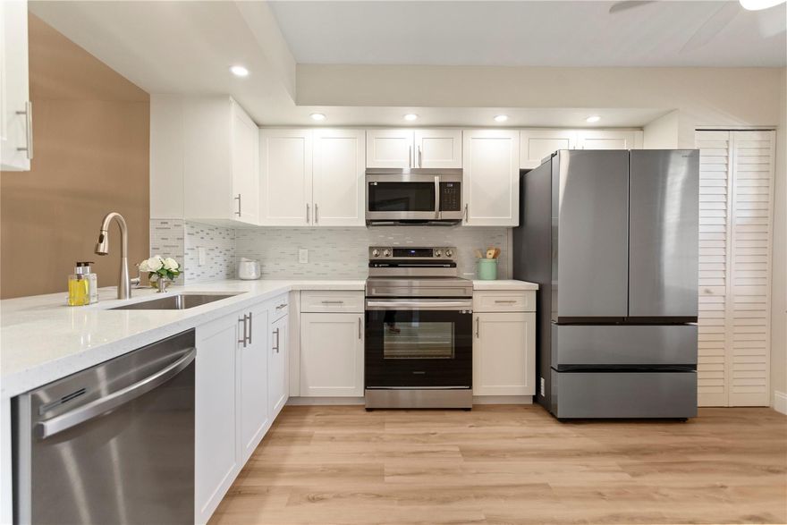 Another beautified property . Two bedroom, two bath with new waterproof flooring throughout and floorboards, New kitchen, cabinets and countertops, new Samsung appliances. Custom vanities and tops in bath rooms along with heated/LCD lighted mirror in master bath. Includes tiled, balcony with slider doors over screen overlooking a majestic view . Condo fee includes cable, water, & internet. community for age 55+ offers you: Free Shuttles, Swimming pools, Tennis Courts, Pickle Ball, golf fields, Sailboat & Paddle boats, health club, fitness Center, 6M Remodel of the clubhouse, 1200-seat theater, card room, pool table, athletic club.  (1 resident must be 55. Anyone over 18 may reside)