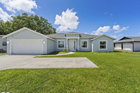 Photo of 981 SW California Boulevard, Port Saint Lucie, FL 34953 (MLS # B26029828)