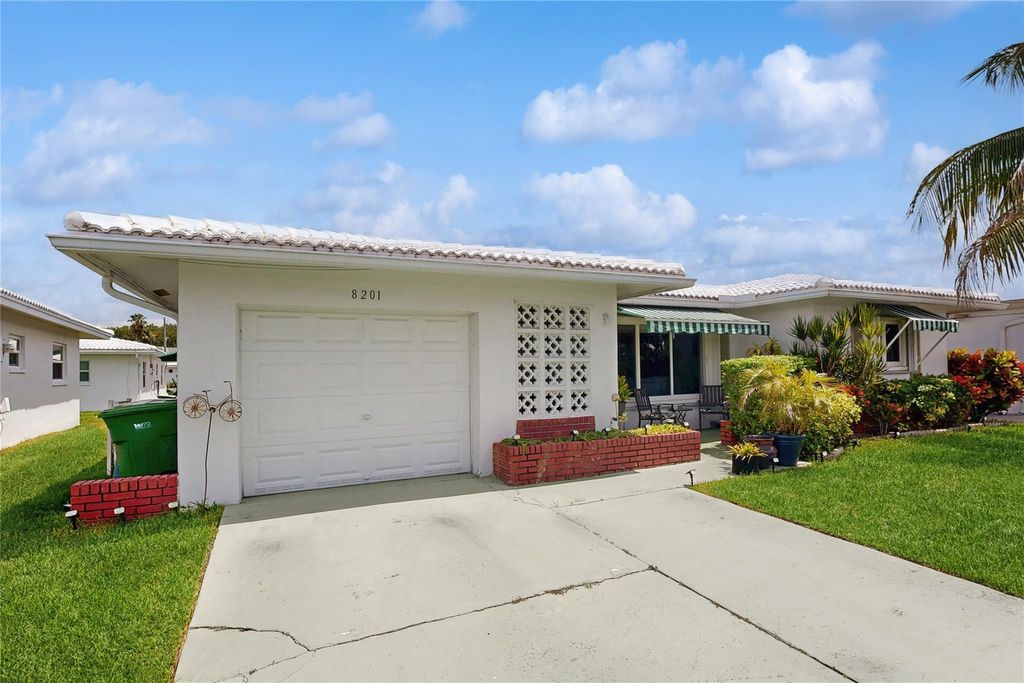 Photo of 8201 NW 59th Ct, Tamarac, FL 33321 (MLS # F10515567)