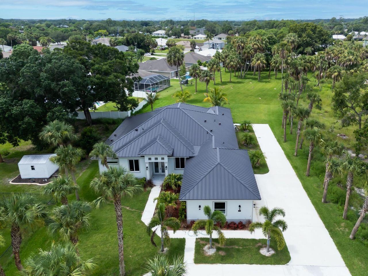 Over size lot, you can build your own tennis court or golf course in your Prive area. Kitchen and bath whit beautiful Quarz. 5 Beth/3 1/2 Bath, Metal Roof. Big driveway for Boat or RV. All floors in Porcelain tile. Gas stove. Beautifull pool Travertine floors.