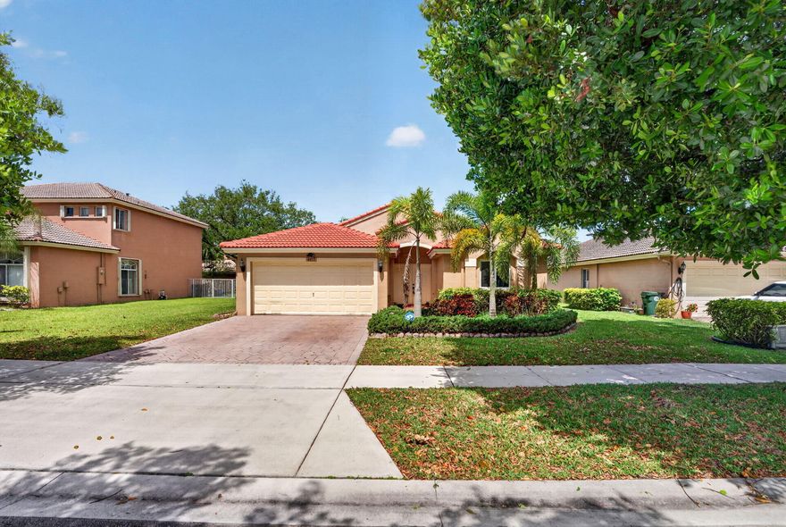A ONE OF A KIND SINGLE-FAMILY LAKEFRONT HOME IN THE SOUGHT AFTER COMMUNITY OF BANYAN TRAILS W/ THE BEST SCHOOLS IN COCONUT CREEK. BRICK PAVER DRIVE & 2 CAR GAR W/ OPENER. COMPLETELY RENOVATED, WOOD GRAIN KIT CABINETS, CROWN MOLDINGS & PANTRY GRANITE TOPS, SS APPLI & BREAKFAST BAR, NEWER A/C, DIGITIAL THERMOSTAT & SECURITY ALARM SYSTEM/ RING DOORBELL. FRONT LOAD W&D IN SEPERATE LAUNDRY RM W/ WOOD GRAIN STORAGE CABINETS REMODLED BATHS GRANITE TOPS UNDER MOUNT SINKS, NEW FULL SIZE MIRRORS & LIGHT FIXTURES. IMPACT WINDOWS AND GLASS, MAIN FLOOR LARGE TILE, CARPET IN BEDROMS, M/BEDRM HIGH CEILINGS WALK IN CALIFORNIA CUSTOM CLOSETS FANS IN ALL BEDRMS FENCED BACK YARD WITH PATIO AND POOL FOR BBQ CABLE TV, 2 COMMUNITY POOLS CLUBHOUSE FITNESS CTR, BILLIARD RM WHAT ARE YOU WAITING FOR? HOA information is attached to MLS documents