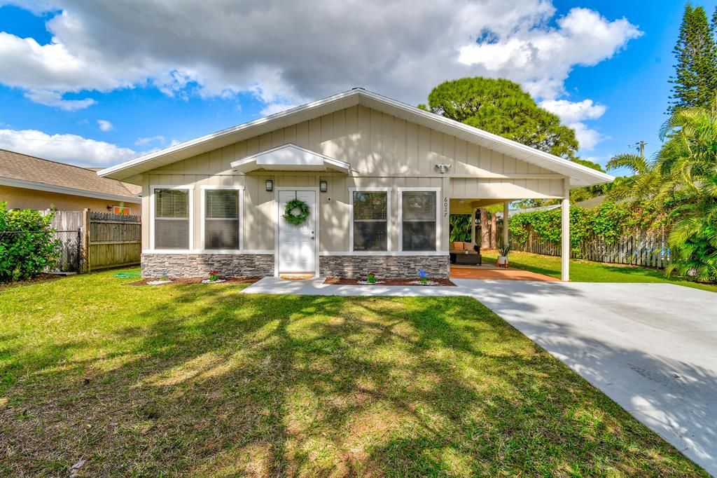 Photo of 6027 Roger Street, Jupiter, FL 33458 (MLS # R10862912)