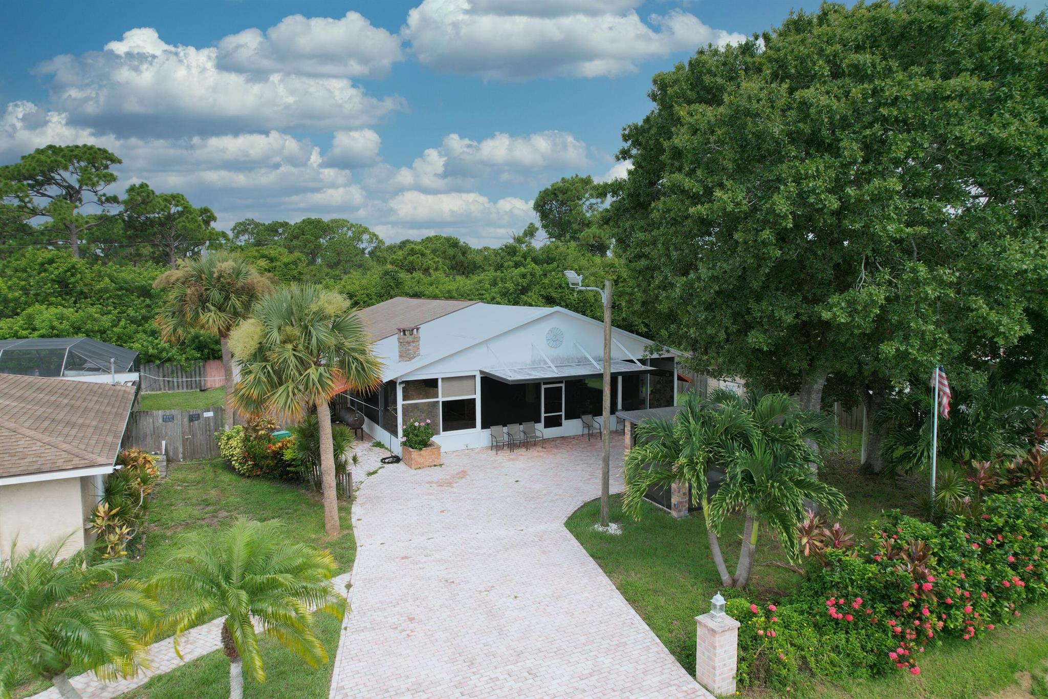 A truly unique rental property that you may find appealing. This fully furnished space is designed for those who appreciate a distinctive living experience. It features a huge open-concept great room with one bedroom, blending the living room, kitchen, family area, and a fun room. What sets this property apart are the amenities included in the rental: a pool table, and two slot machines, perfect for entertaining friends or enjoying a cozy night in. One of the standout features is the gigantic roofed & screened porch, which feels like an extension of your living space. Imagine enjoying your morning coffee or hosting gatherings in this area, complete with a fireplace, waterfall, and built-in grill. This is truly a one-of-a-kind rental that you have to see to believe.