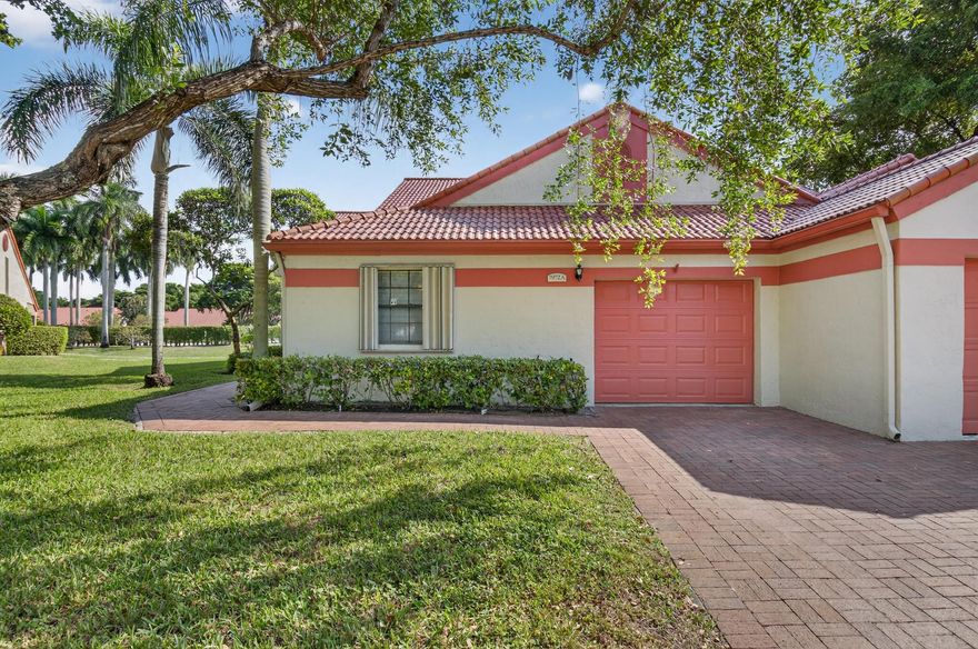 Open, Spacious and Bright! .Great Bones!..Make this villa yours...Unit features 2 BR + large flexible bonus room which can be used for 3rd BR, office or den, 2 BA's.  separate laundry room, stainless kitchen appliances, newer washer/dryer, hurricane shutters (complete), vaulted ceilings and a screened patio/lanai with roll down shutters overlooking a private lake and garden view.   An attached garage completes this picture. This gated 55+ community features resort style amenities, a renovated clubhouse, pickle ball, tennis, fitness center, pool, active social clubs and year round entertainment and events.  Unbeatable location just 7 miles from the beach and downtown Delray. You are surrounded by best restaurants and shopping. This unit just needs your TLC to make it yours.  Great buy!