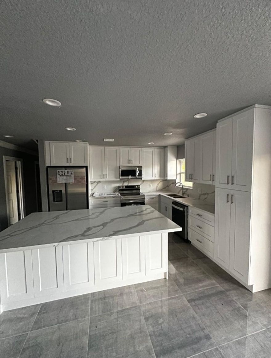 Welcome to your brand-new home in the heart of Lauderhill! This stunning 3-bedroom, 2-bathroom residence features an open floorplan designed for effortless living and entertaining. Step into a bright, airy space with thoughtful details throughout. Out back, enjoy your own private pool — perfect for weekend relaxation or hosting unforgettable gatherings. Whether you're a first-time buyer or looking to upgrade, this move-in-ready gem is ready to impress — just bring your toothbrush and move right in! Don’t miss this rare opportunity to own a new construction pool home with style, comfort, and convenience.