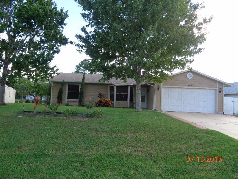 Spacious 3/2 home with pool. huge porch, screen enclosed pool. House faces back to a canal providing a quiet and private setting to relax and enjoy outdoors. Flooring throughout the house is wood like vinyl flooring. A MUST-SEE HOME!!! Pool and Lawn service not included