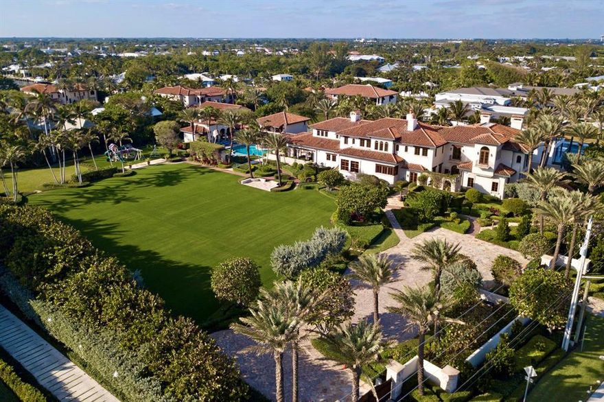An incomparable mode of private beach living awaits in this all-encompassing glorious Mediterranean Revival estate by the sea. This expansive property forms one of the largest remaining estates in Delray Beach, now totaling 2.767 acres, with 308 feet of frontage across from the Atlantic Ocean. Courchene Development Corporation, Dailey Janssen Architects and Marc-Michaels Interior Designs collaborated to create the sublime beauty that is this masterful estate. Great care was taken to integrate authentic Old World elements with contemporary luxuries throughout the sophisticated interior. This residence is exquisitely finished with antiqued European oak, mahogany, Pecky cypress, limestone, coral, and Alhambra tile. The main house and guest apartment consist of more than 26,000 total sq ft