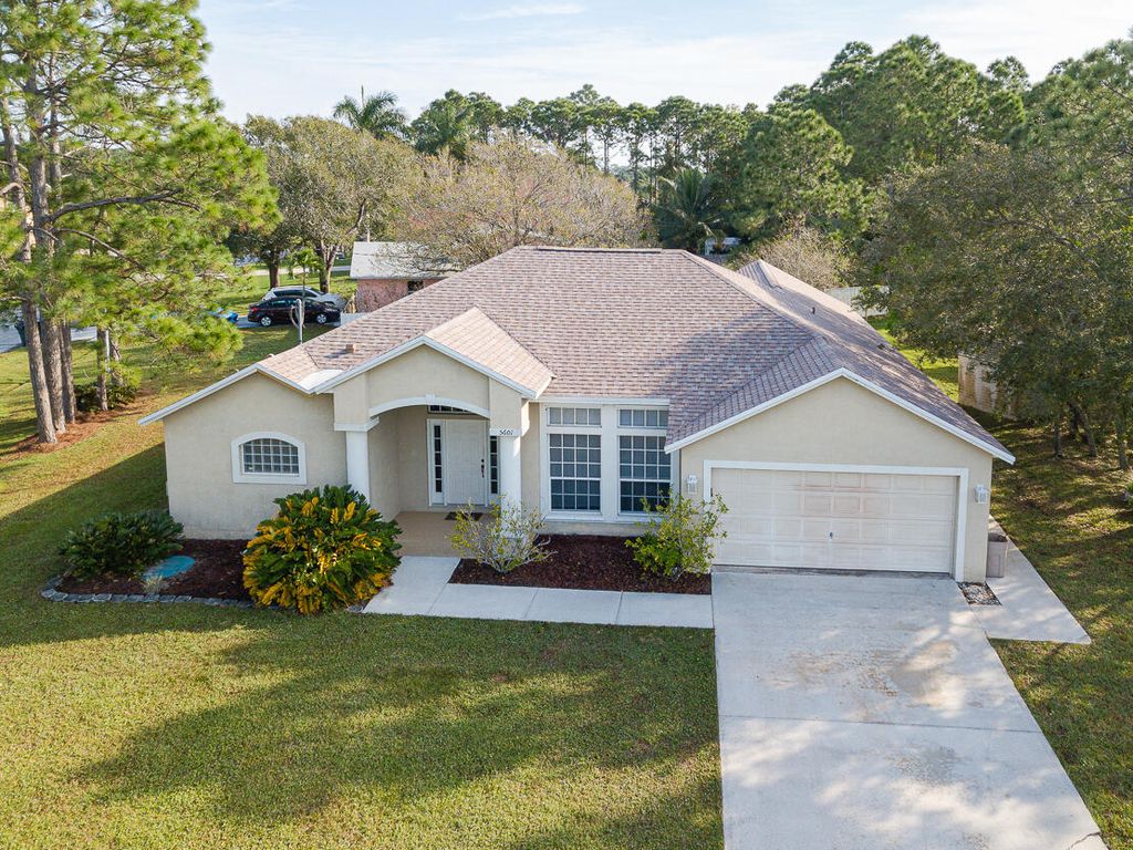 Photo of 5601 NW Scepter Drive, Port Saint Lucie, FL 34983 (MLS # R10944870)