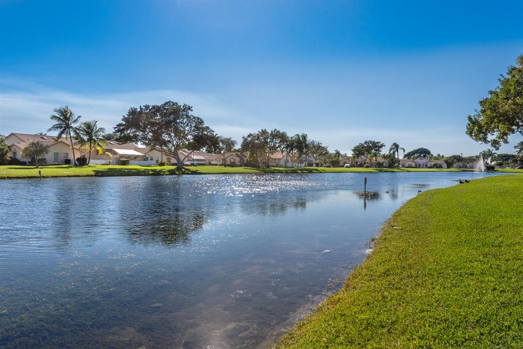 Very rare townhouse rental in the best part of Boca. Enjoy this renovated home with no carpeting, featuring all new floors and bathrooms. Newer appliances, new AC and impact windows. Enjoy sitting in the covered, screened patio with beautiful lake views in this community with excellent amenities including clubhouse with fitness center, 3 heated pools and tennis. Bring your family to the community with friendly sidewalks and great areas for kids to play and cycle.