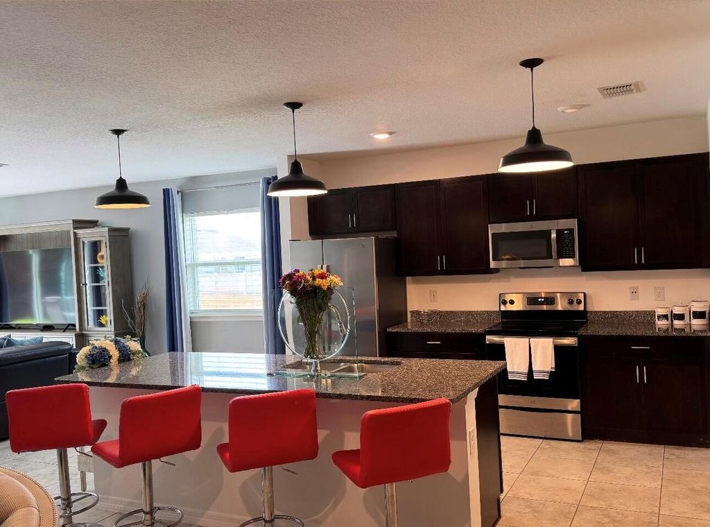 Photo of 4617 SW Scanavino Street, Port Saint Lucie, FL 34953 (MLS # R11109976)