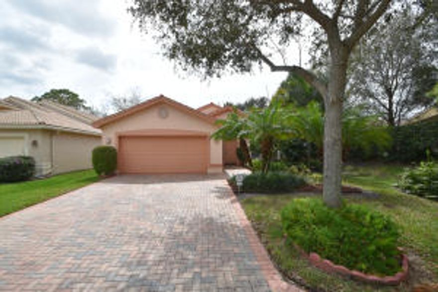 Beautiful Adriatic floor plan with french doors leading out to screened patio backing south to garden with tropical plantings, gourmet kitchen has 42'' white cabinets, granite counters and back splash, slide in stove, large pass through to dining room with 3 hanging fixtures, 3rd bedroom being used as a den/office with french doors, 2nd bath has stall shower, master bath and guest bath have tile to ceiling & mirrors to ceiling, rounded walls throughout, accordion hurricane shutters, garage is extended 2 feet longer and driveway widened! Private  lot with no roads or noise! Do not miss this one!!! Join the Valencia Palms lifestyle, newly renovated clubhouse,spectacular resort style pool,state of the art fitness center,hard tru tennis courts,pickle ball,bocce ball,cafe & more