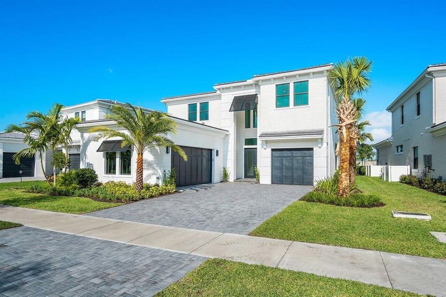 BRAND NEW CONSTRUCTION, never lived in with PREMIUM LAKE VIEW in Palm Beach Gardens new centrally located, guard gated community of Artistry. With nearly 5,200 square feet of luxury living and over 350K in upgrades, this West model offers 5 BR & 5.1 BA, den, club room, upstairs loft and spacious modern living areas.  The main level features formal and informal living areas, a chef worthy kitchen with upgraded cabinetry and appliances, spacious family and dining rooms.  Also on the main level is the grand Owner's suite overlooking the lanai and yard, housing a huge spa-like bathroom with dual vanities, large shower and separate soaking tub and walk-in closet.   The generous guest bedrooms are all on the second floor and feature en suite baths and walk-in closets.