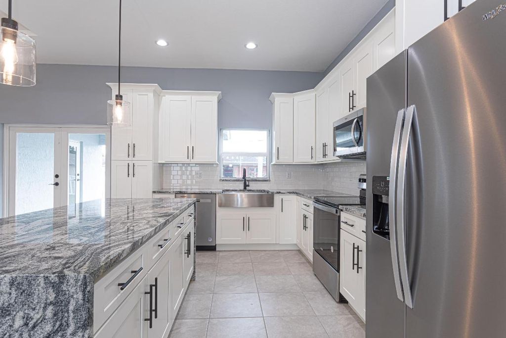 Photo of 2173 SW Trenton Lane, Port Saint Lucie, FL 34984 (MLS # R10949406)