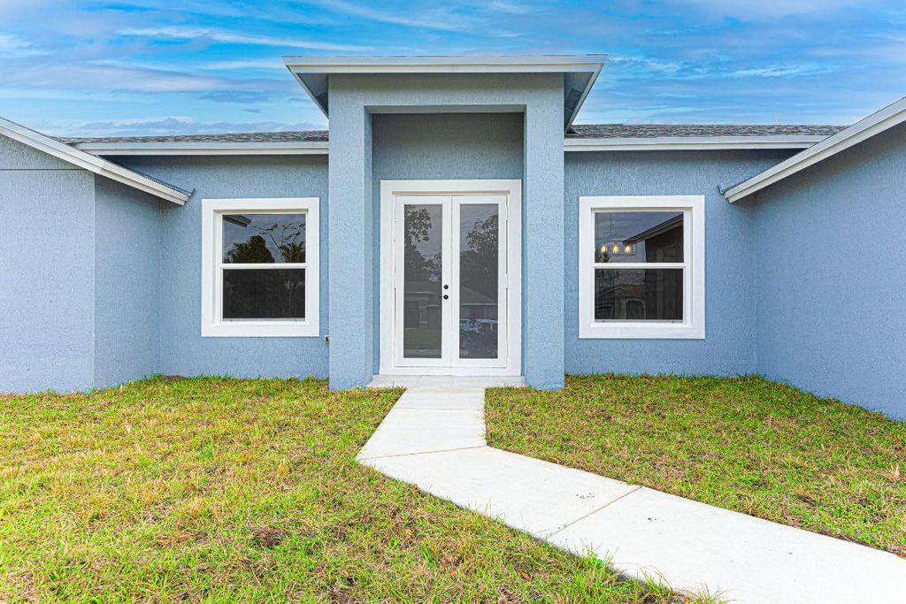 Photo of 2173 SW Trenton Lane, Port Saint Lucie, FL 34984 (MLS # R10949406)
