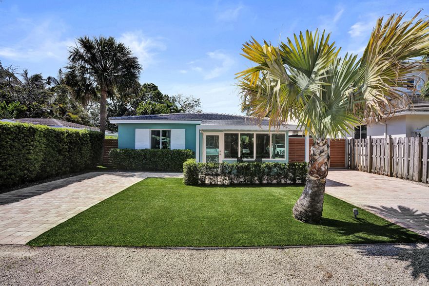 **Rare Turnkey Tarpon River home with Entertainer's Backyard** This private home lives larger than expected and has a huge backyard designed for entertaining. The flexible layout offers two separate living areas plus a front Florida room. Updated bathroom and kitchen with stainless steel appliances and granite countertops. The outdoor space features new turf, a covered patio with TV, gas fireplace and a fully built-out summer kitchen—perfect for hosting. Complete hurricane protection with impact windows, along with natural gas, generator hookup, and a 2017 roof for added peace of mind. Located in Tarpon River, a highly desirable neighborhood seeing significant growth and redevelopment. Room for a pool and addition. Located 5 minutes to Las Olas, 10 to the Beach, 15 to FTL Airport.