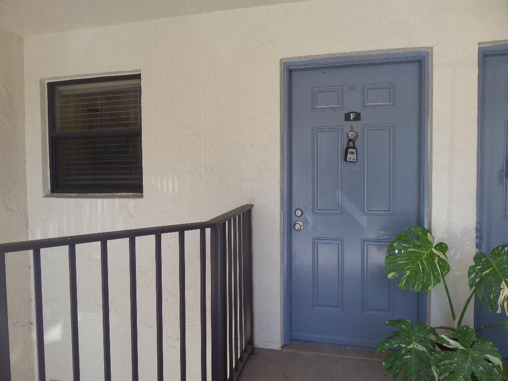 Photo of 1523 LAKE CRYSTAL Drive #F, West Palm Beach, FL 33411 (MLS # B26071919)