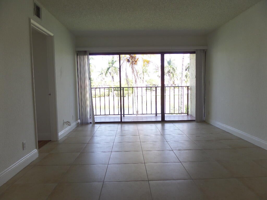 Photo of 1523 LAKE CRYSTAL Drive #F, West Palm Beach, FL 33411 (MLS # B26071919)