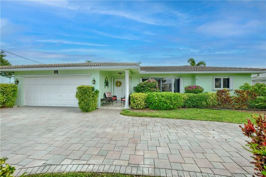 Lovely 4/2 home in prestigious Sunset East!!! Spacious “Rutenberg” split floor plan with large family room addition in back overlooking the pool area.  Formal living room has a charming  bay window which connects to dining room.  Kitchen has been updated with beautiful wood cabinets, granite counters and SS appliances. Both Bathrooms have updates with master having double sinks and a custom walk in closet . Oversized laundry room with front load W/D, washbasin, tankless hot water heater & extra storage.    This attractive home sits on one of the larger lots in the area(10,817sf) with a sparkling pool, tropical landscaping & even a Tiki Hut for enjoying the nice ocean breezes. Full 2 CG has custom interlocking floor, Located close to world famous Deerfield Beaches, Restaurants and shopping.