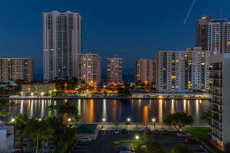 MUST SEE...Florida living at it's best; Breath taking view of inter-coastal. Stones throw to Beach, casino, shopping, restaurants. Nearby to new 'STATE OF THE ART' park. 24 hr. security. Located on prestigious Three Island Cul-de-sac.  Murphy bed and shelving in Master closet included. Granite Kitchen counter tops.