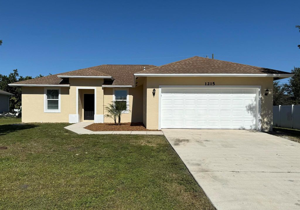 Photo of 1215 SW Ermine Avenue, Port Saint Lucie, FL 34953 (MLS # R11057539)