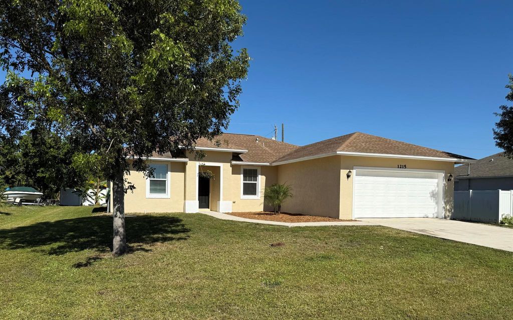 Photo of 1215 SW Ermine Avenue, Port Saint Lucie, FL 34953 (MLS # R11057539)