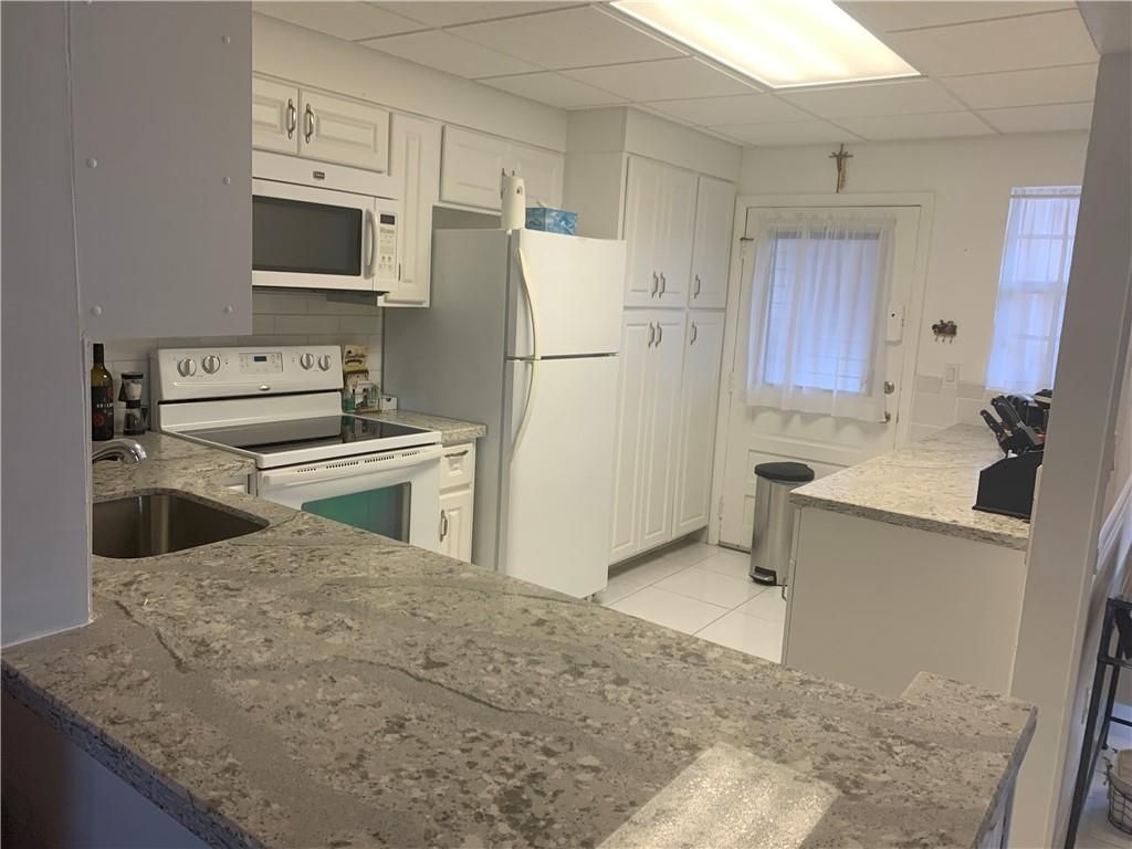 Photo of 2861 NW 47th Ter #301, Lauderdale Lakes, FL 33313 (MLS # F10310556)