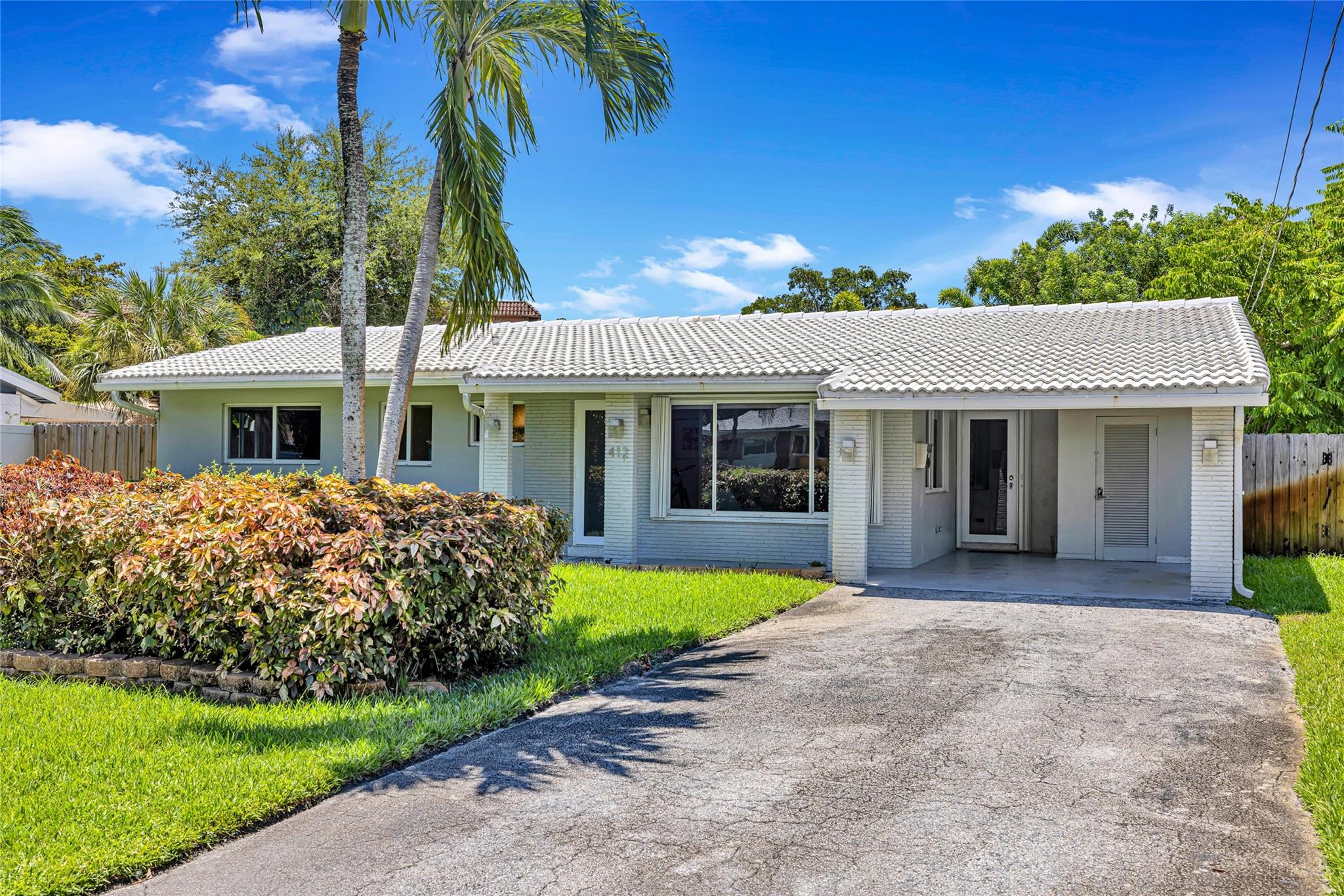 Renovated waterfront pool home in idyllic Wilton Manors Westside! Open living area w/formal living room, a sun- kissed Florida/family room for you to enjoy serene views of pool & waterway and a HUGE kitchen featuring granite counters, an abundance of rich wood cabinetry, stainless appliances (including a separate wine cooler!) and a walk-in pantry. All three bedrooms have restored terrazzo flooring, black-out shades and an oversized or walk-in closet. With a whole house generator and impact glass or accordion shutters for every door & window, this is THE house you want in the event of a hurricane! Great outdoor space w/screened patio in back and a front yard w/vibrant landscaping giving home a curb appeal you will love coming home to every day!