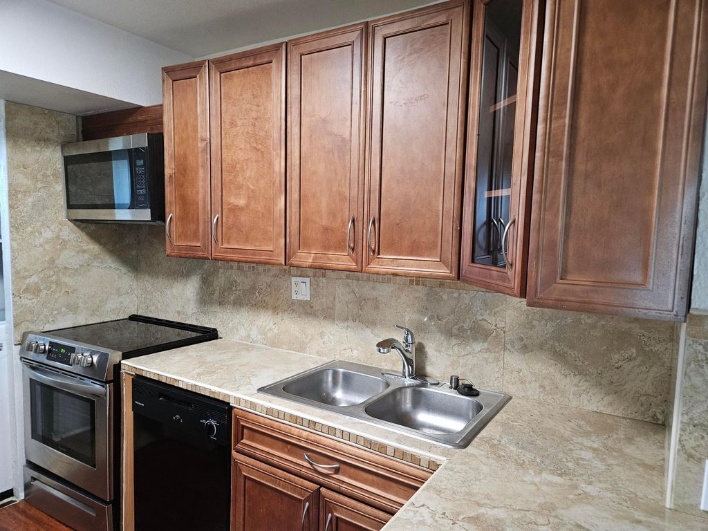 Photo of 8000 S Colony Cir #207, Tamarac, FL 33321 (MLS # B26010447)