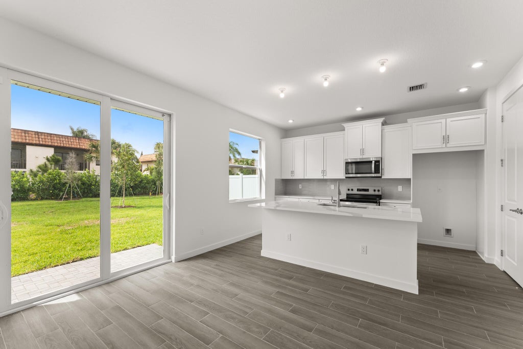 Photo of 7296 CLAUDELLE Street, Lake Worth, FL 33467 (MLS # B26066638)