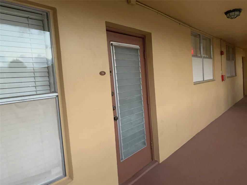 Photo of 6051 NW 61st Avenue #211, Tamarac, FL 33319 (MLS # B26030217)