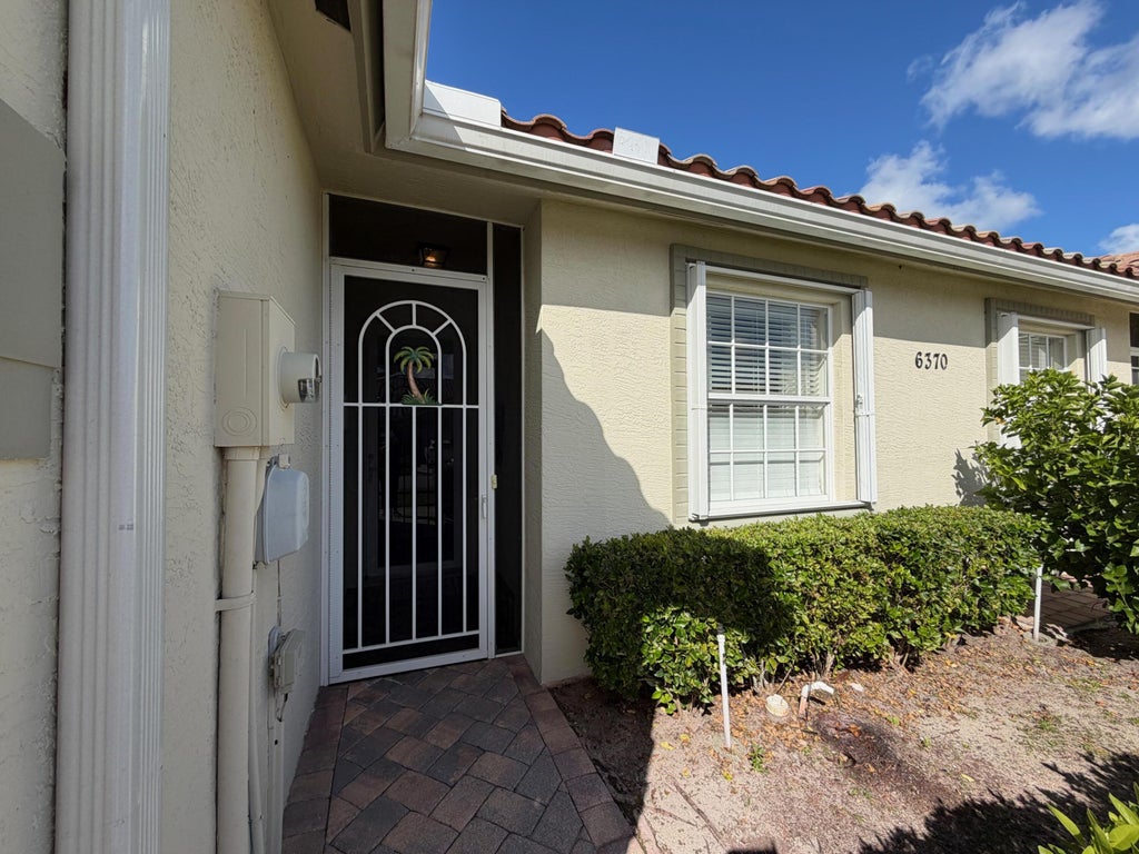 Photo of 6370 OXFORD Circle #102, Vero Beach, FL 32966 (MLS # B26092674)
