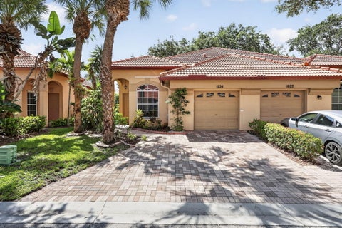 Photo of 1020 Via Jardin, Riviera Beach, FL 33418 (MLS # B26070125)