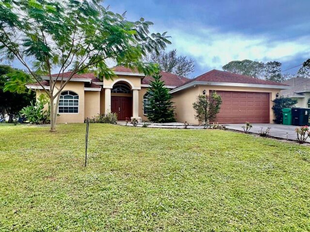 Photo of 2471 SW Madiera Street, Port Saint Lucie, FL 34953 (MLS # R10943141)
