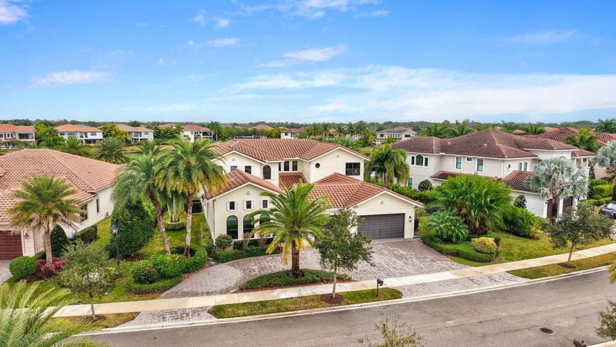 Set on an oversized 16,269 square foot lot, this stunning home offers exceptional privacy and exudes refined elegance. The main floor features the master suite along with two additional spacious suites. The dine-in chef’s kitchen is perfect for entertaining, seamlessly opening to a breakfast nook and a large family room. This open-concept kitchen boasts an oversized quartz center island, beautiful white cabinets, a large custom pantry, and top-of-the-line appliances. Upstairs, you'll find three more bedrooms and an impressive soundproof theater room. Each bedroom is equipped with its own ensuite bathroom, enhancing the home's luxurious appeal. The expansive, fenced backyard offers plenty of play space, an outdoor kitchen, and breathtaking lake views!