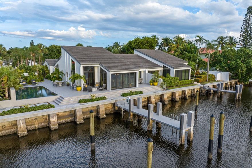Private Waterfront Villa with Protected Preserve Views.Experience unparalleled coastal living in this reimagined waterfront villa, where elegance and tranquility meet. Perfectly positioned along a wide waterfront with protected views of a stunning nature preserve and the Intracoastal, this residence offers both privacy and beauty in a coveted location.Step inside to expansive living spaces filled with natural light and endless water views from nearly every room. The gourmet kitchen showcases custom white oak cabinetry, top-of-the-line appliances, and hardwood flooring, seamlessly designed for both entertaining and everyday living.Accommodations include a luxurious master suite with spa-inspired bath and custom closets, a VIP suite with en-suite bath, and a spacious guest bedroom,