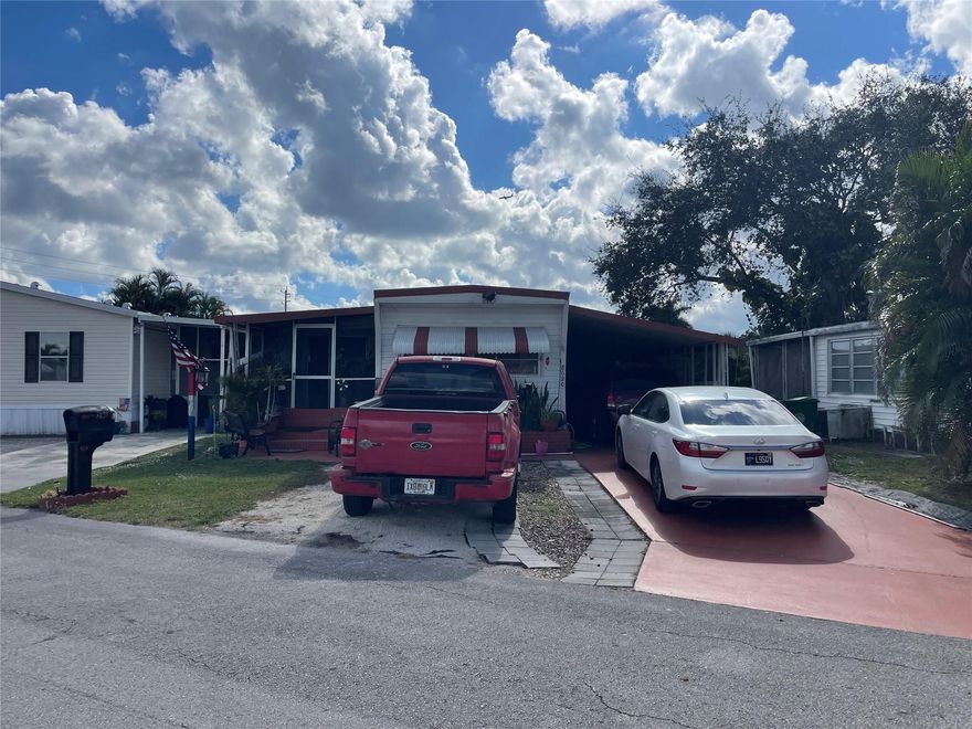 Beautiful 3/2 with push out - carport - shed - screened in porch - -split bedroom plan -eat-in-kitchen - shutters - - Florida room - -central air - nice sq ft - assoc. states it is HOPA verified - lots of parking - priced right for quick sale - truly a must see.........