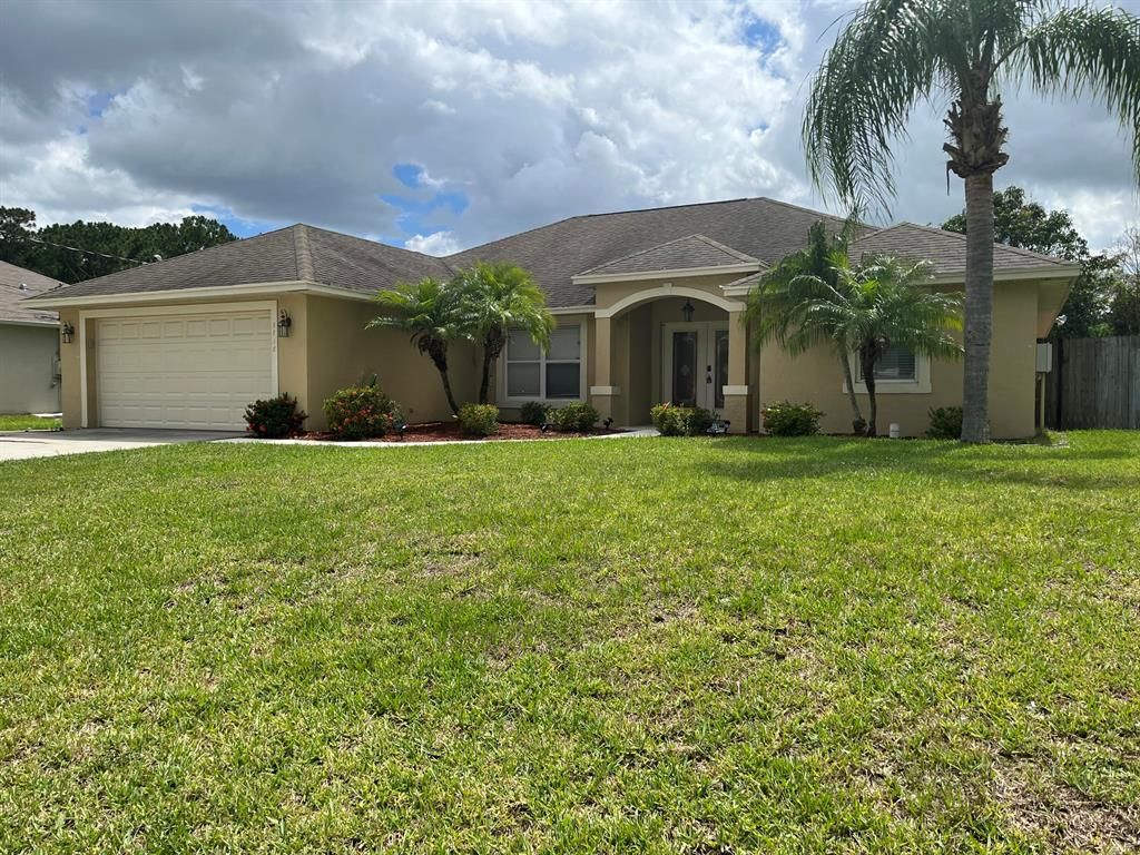 Photo of 3718 SW Masilunas Street, Port Saint Lucie, FL 34953 (MLS # R10877406)