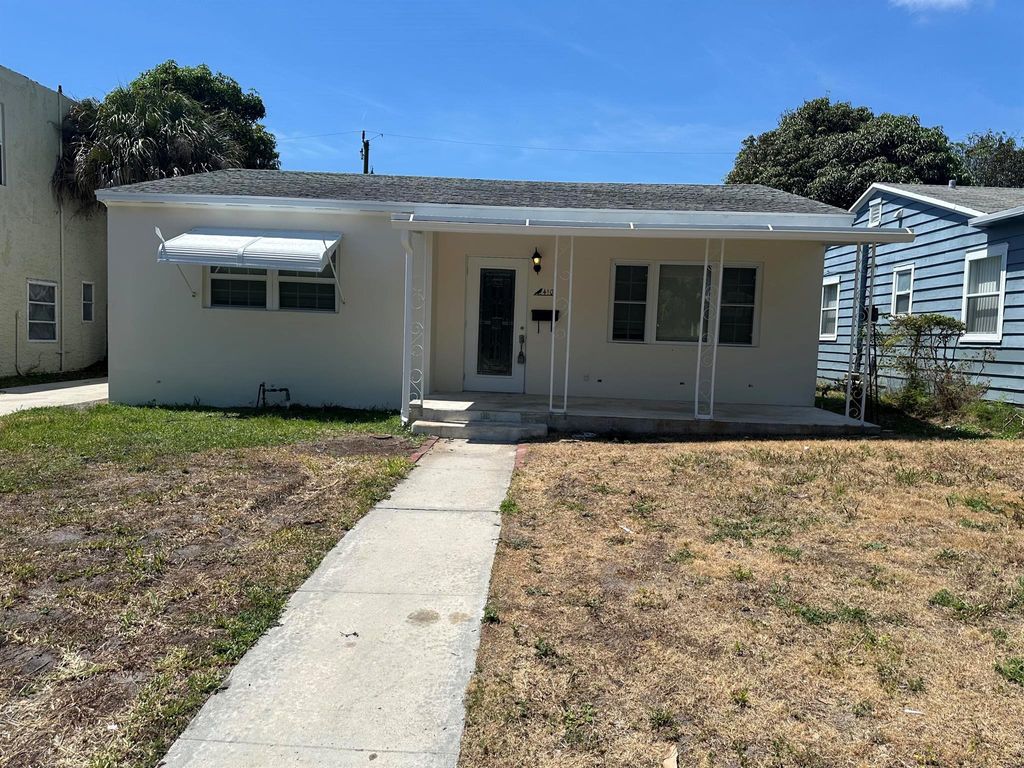 Photo of 410 44th Street, West Palm Beach, FL 33407 (MLS # R11088653)