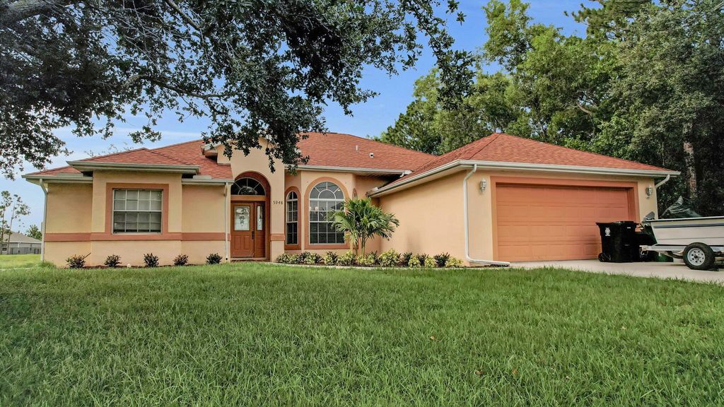 Photo of 5948 NW Hann Drive, Port St Lucie, FL 34986 (MLS # R10899263)