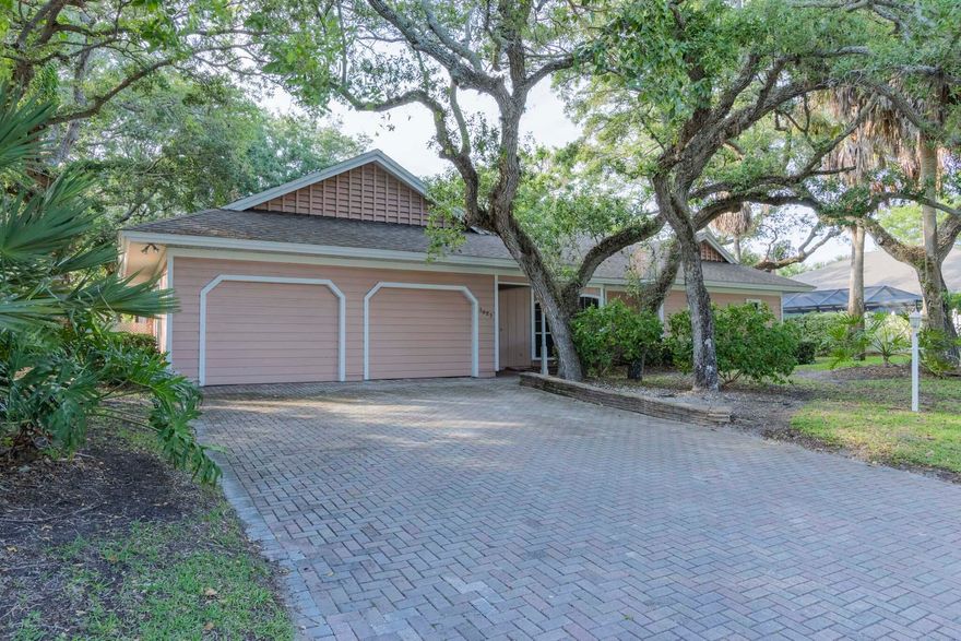 NOTE: This property is NOT for rent!!  Experience the best of island living in this spacious 1987 home, ideally situated in a community with a guarded gate. Open floor plan w/endless potential to customize & make it your own. Vaulted ceilings (some accented with wood) create a warm, airy ambiance, while multiple living spaces open to views of the screened-in 28x14 pool w/ outdoor shower. Mature trees & well-appointed neighboring properties enhance both the privacy & curb appeal. Enjoy deeded access to both the ocean and the river, offering opportunities for boating, beach & a true coastal lifestyle. Bring your vision & create your own paradise!  Original owners finally selling!!!  Pool resurfaced in 2020 and new pool pump in 2026! Room dimensions to be validated by buyer