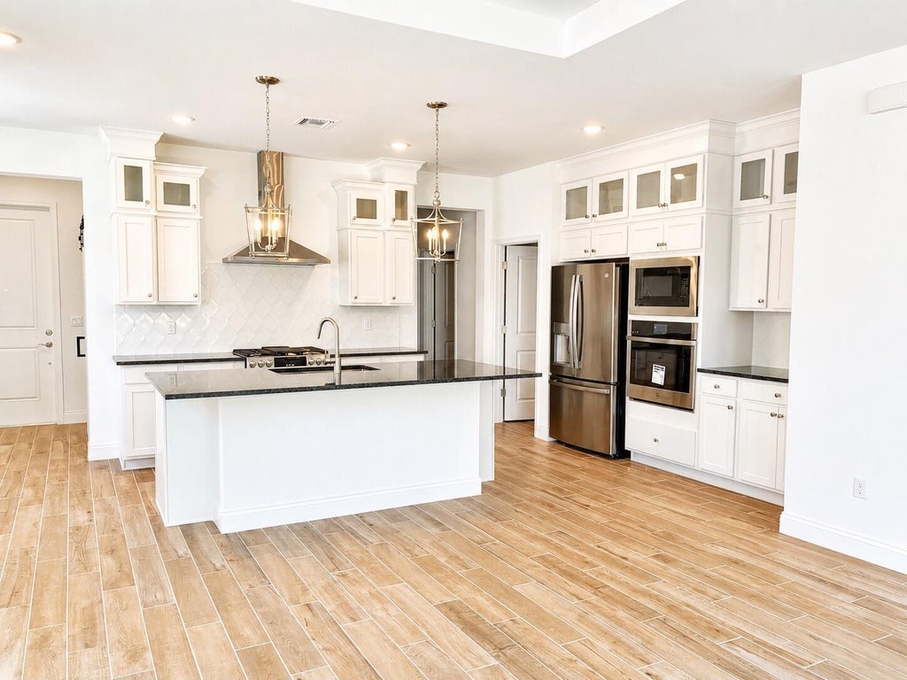 Photo of 10083 NW Dreamweaver Road, Port Saint Lucie, FL 34987 (MLS # B26064392)