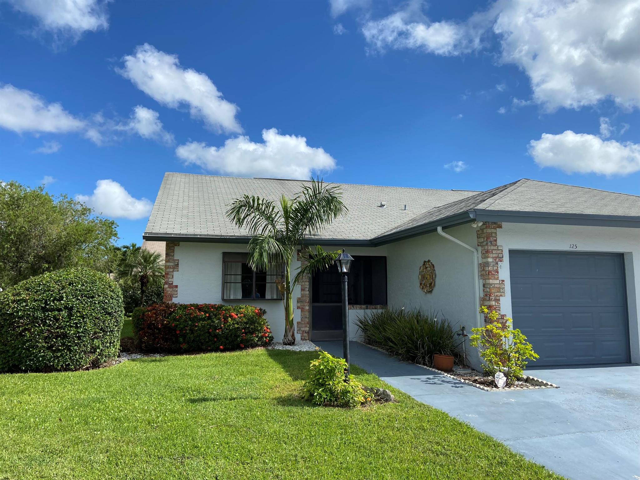 Totally renovated with washer and dryer and pets considered. Perfect, two beds, two baths plus a large screened patio and an attached 1 car garage. Large eat-in kitchen with granite counters and stainless appliances, vaulted high ceilings, corner unit with extra windows, lots of natural light and garden views, updated bathrooms, newer AC unit located in Indian Creek with all the best Jupiter has to offer including A rated Jupiter schools and amenities within a short distance including golf (across the street), shops, restaurants, I95, turnpike, Jupiter beaches. Trucks OK. No commercial vehicles, boats or trailers UNLESS it fits in, and is stored in, the garage. One large dog or 2 small dogs (total under 40lbs) may be considered with an additional deposit. This is a NON SMOKING home.