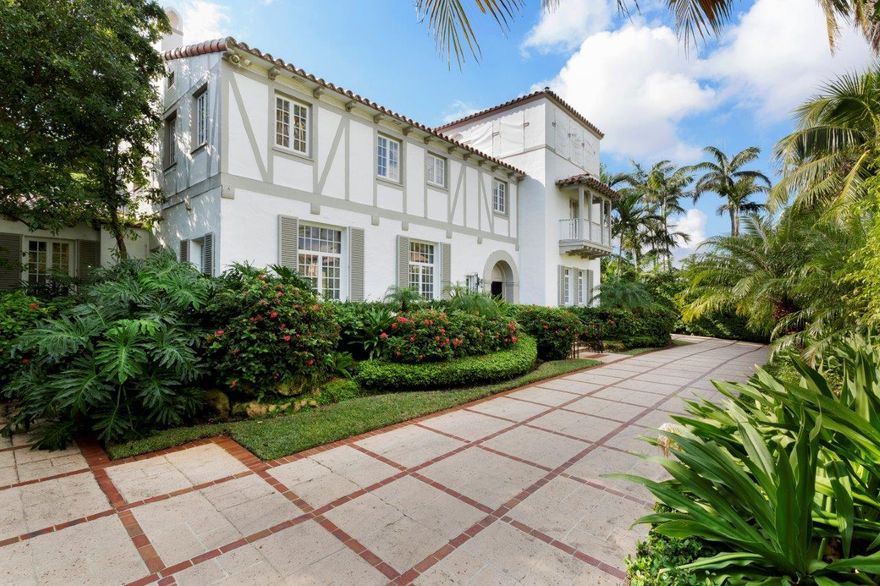 Landmarked Maurice Fatio in the Estate Section of Palm Beach. Built in 1930 in the Mediterranean Revival style and owned by the architect when built. The half-timbered facade is an unusual feature for the style, yet it is a good example of the work of the master architect. The 3rd floor tower is designed as a mirador with casement windows giving views of the Atlantic Ocean and the Intracoastal. The home sits high on a nicely elevated lot of nearly 1/2 acre. Many original details, including the flooring, remain to be restored or renovated. The large, covered loggia has pecky cypress ceiling, seating & dining areas, a wet bar, cabana powder room, all surrounding the large pool. A 2BR/1BA guest apartment over the garage w/efficiency kitchen.