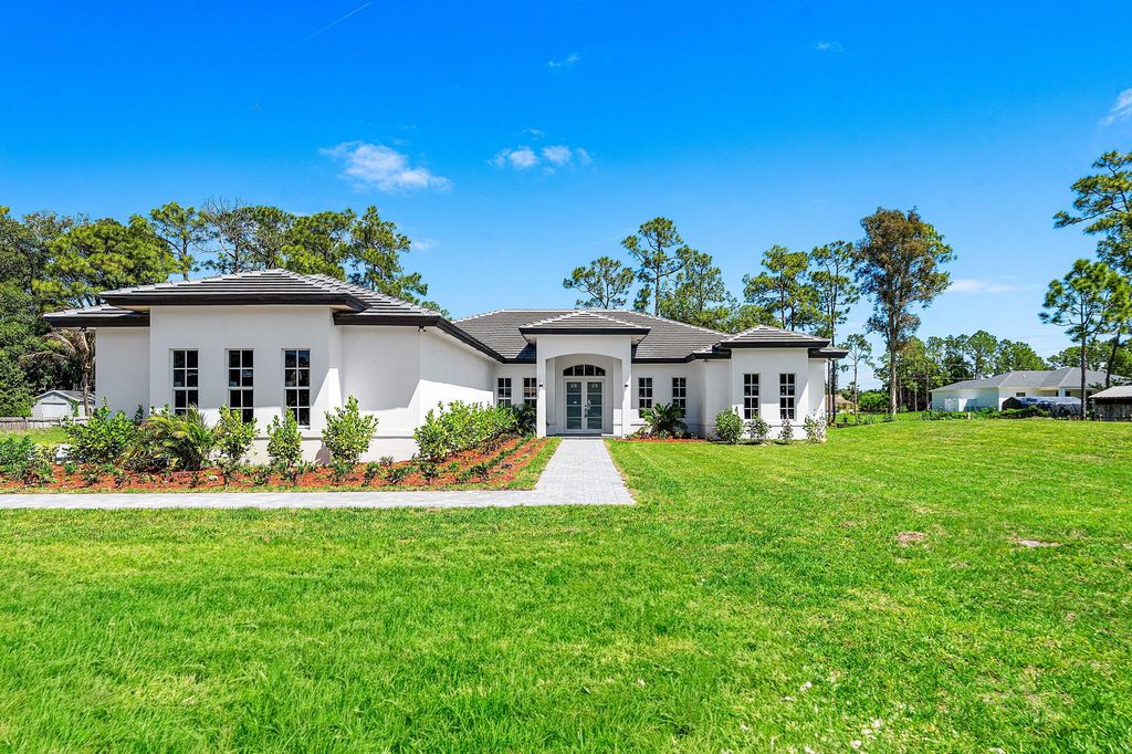 Photo of 10509 Temple Boulevard, The Acreage, FL 33470 (MLS # B26019487)